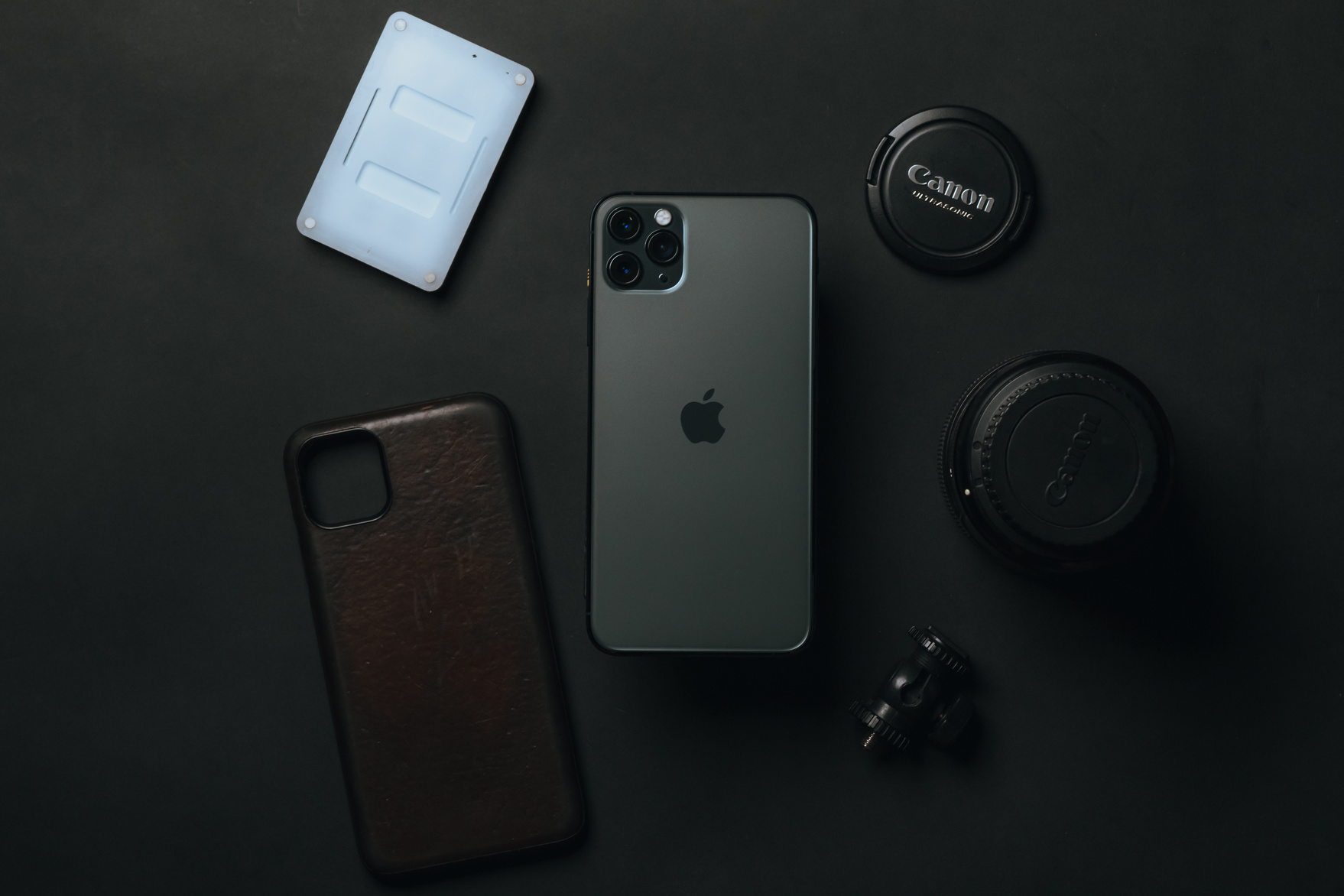 Smartphone placed among gadgets on table